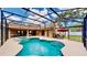 A screened-in pool with an attached hot tub at 14723 Pine Cone Trl, Clermont, FL 34711