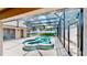 Screened-in pool and spa with a sun deck offers a private outdoor retreat at 14723 Pine Cone Trl, Clermont, FL 34711
