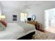 Bedroom with a bed and sliding glass door to screened-in patio at 16631 Champions Ct, Clermont, FL 34711