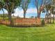 Brick Palisades community sign with manicured bushes set amongst mature landscaping and grass at 16631 Champions Ct, Clermont, FL 34711