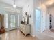 Open foyer featuring tile flooring, a decorative table, and natural light from the front door at 16631 Champions Ct, Clermont, FL 34711