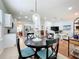 Open kitchen and living area featuring modern appliances and stylish decor at 16631 Champions Ct, Clermont, FL 34711