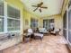 Spacious tiled patio with ample seating perfect for outdoor entertaining and relaxation at 16631 Champions Ct, Clermont, FL 34711