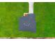 Aerial view of a home with a gray roof and surrounded by a green lawn at 17485 Sw 41St Cir, Ocala, FL 34473