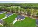 New home with lush green lawn in community backing up to mature forest, a perfect blend of nature and neighborhood at 17485 Sw 41St Cir, Ocala, FL 34473