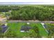 New home with lush green lawn in community backing up to mature forest, a perfect blend of nature and neighborhood at 17485 Sw 41St Cir, Ocala, FL 34473