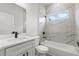 Bathroom featuring tile shower and tub, vanity, and natural light from window at 17485 Sw 41St Cir, Ocala, FL 34473