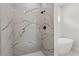 Bathroom featuring tile shower with black fixtures and freestanding tub at 17485 Sw 41St Cir, Ocala, FL 34473