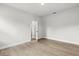 Neutral bedroom featuring wood floors and an open doorway at 17485 Sw 41St Cir, Ocala, FL 34473