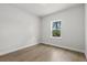 Bedroom featuring wood floors, a neutral color scheme, and natural light from the window at 17485 Sw 41St Cir, Ocala, FL 34473
