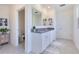 Bright bathroom with double vanity, granite countertop, and tiled floors at 1854 Juneberry St, Clermont, FL 34715