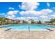 Beautiful community pool with lounge chairs for relaxing and enjoying the sun at 1854 Juneberry St, Clermont, FL 34715