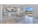 Open-concept kitchen and dining area with abundant natural light, overlooking the backyard at 1854 Juneberry St, Clermont, FL 34715