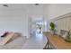 Bright hallway with decorative wood accents leads into a dining area with scenic views at 1854 Juneberry St, Clermont, FL 34715