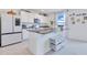 Open concept kitchen with granite countertops and stainless appliances, plenty of storage space at 1854 Juneberry St, Clermont, FL 34715
