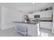 Spacious kitchen boasts a large island with ample countertop space and modern appliances at 1854 Juneberry St, Clermont, FL 34715