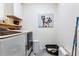 Laundry room featuring a side-by-side washer and dryer, and a painted portrait of a dog at 1854 Juneberry St, Clermont, FL 34715