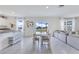 Open-concept living space with dining area and sliding doors to the outdoors at 1854 Juneberry St, Clermont, FL 34715