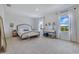 Main bedroom features carpet, a vanity table, large bed, and bright windows at 1854 Juneberry St, Clermont, FL 34715