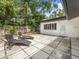 Stylish backyard patio with geometric tiling and lounge chairs, ideal for outdoor relaxation and entertaining at 2244 Brookshire Ave, Winter Park, FL 32792