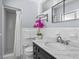 Updated bathroom features a marble vanity and tiled shower at 2244 Brookshire Ave, Winter Park, FL 32792