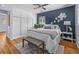 Comfortable bedroom features a large bed, dark wall accent, and lots of closet space at 2244 Brookshire Ave, Winter Park, FL 32792