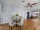 Bright dining area features a glass table and four chairs, as well as hardwood flooring at 2244 Brookshire Ave, Winter Park, FL 32792