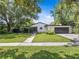Charming single story home with freshly painted exterior, mature trees and well maintained lawn at 2244 Brookshire Ave, Winter Park, FL 32792