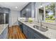 Bright kitchen featuring stainless steel appliances, granite countertops, and updated cabinetry at 2244 Brookshire Ave, Winter Park, FL 32792