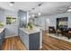 Open kitchen layout with granite countertops, wood floors and a view into the living area at 2244 Brookshire Ave, Winter Park, FL 32792