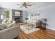 Comfortable living room with fireplace, hardwood floors, and neutral color palette at 2244 Brookshire Ave, Winter Park, FL 32792