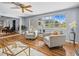 Bright living room area with hardwood floors and lots of natural light from the windows at 2244 Brookshire Ave, Winter Park, FL 32792