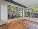 Outdoor patio area with tile flooring, leading to a bright dining room inside at 2244 Brookshire Ave, Winter Park, FL 32792