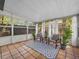 Bright sunroom with tile floors, large windows, and comfortable seating. Perfect for relaxing! at 2244 Brookshire Ave, Winter Park, FL 32792