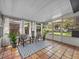 Bright sunroom with tile floors, large windows, and comfortable seating. Great natural light! at 2244 Brookshire Ave, Winter Park, FL 32792