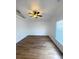 Inviting bedroom boasts wood flooring, neutral paint, and a ceiling fan at 2524 Daffadil Ter, Sanford, FL 32771