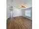 Bright living room boasts wood flooring, neutral paint, and plenty of natural light at 2524 Daffadil Ter, Sanford, FL 32771