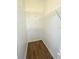 Bright walk-in closet features wood-look floors and plenty of adjustable wire shelving for organization at 2524 Daffadil Ter, Sanford, FL 32771
