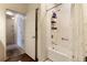 Bathroom with tub and shower featuring a tiled wall and a hardwood floor at 2901 Edenshire Way # 102, Kissimmee, FL 34746