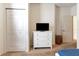 Bedroom featuring a dresser with a television, a closet, and a window at 2901 Edenshire Way # 102, Kissimmee, FL 34746