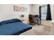 Bedroom with a bed, desk with computer, and a window at 2901 Edenshire Way # 102, Kissimmee, FL 34746