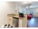 Efficient kitchen space with granite countertops and stainless steel dishwasher at 2901 Edenshire Way # 102, Kissimmee, FL 34746