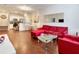 Bright, open living area featuring hardwood floors and an open flow to the kitchen at 2901 Edenshire Way # 102, Kissimmee, FL 34746