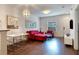 Cozy living room featuring hardwood floors, dining area and an adjacent door at 2901 Edenshire Way # 102, Kissimmee, FL 34746