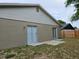 Backyard with a patio and sliding door at 304 Lake Daisy Loop, Winter Haven, FL 33884