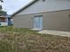 Backyard with a patio and sliding door at 304 Lake Daisy Loop, Winter Haven, FL 33884