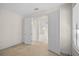 Bedroom featuring open doorframes, carpet floors, and neutral walls at 307 Monterey St, Kissimmee, FL 34759