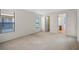 Inviting bedroom with neutral walls, carpet floors, and natural lighting at 307 Monterey St, Kissimmee, FL 34759