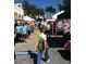Outdoor view of busy farmers market with many customers at 307 Monterey St, Kissimmee, FL 34759