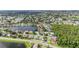 Beautiful aerial view of a lakeside home near a picturesque wooded area at 344 Blue Bayou Dr, Kissimmee, FL 34743